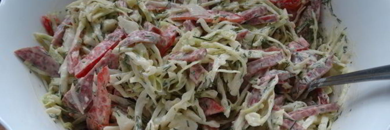 Салат из молодой капусты с колбасой